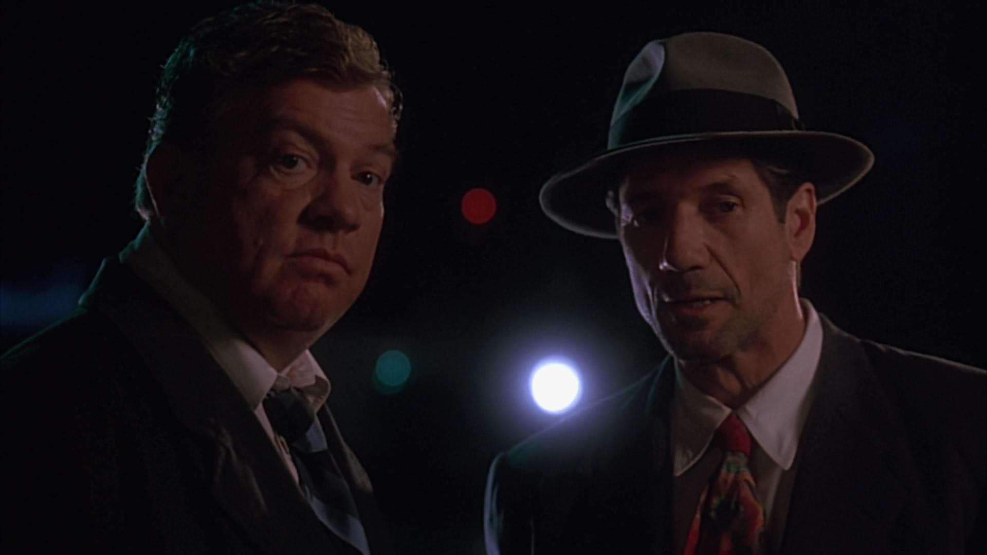 Charles Hallahan and Fred Ward in Cast a Deadly Spell (1991)