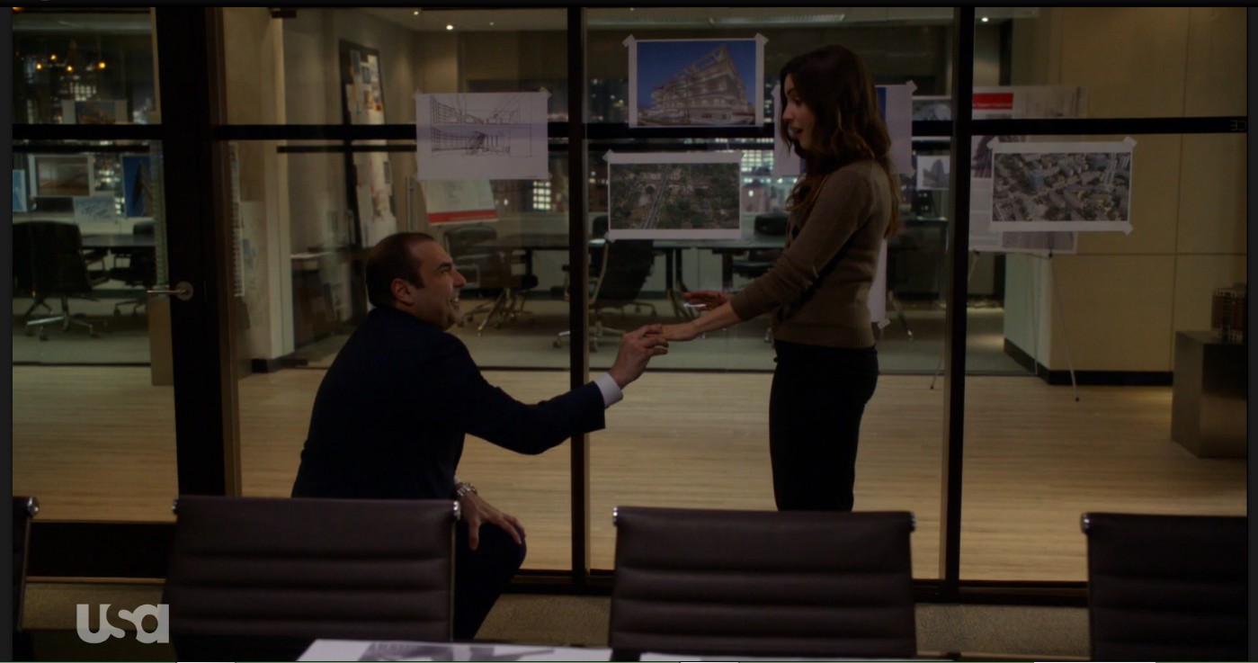 Carly Pope and Rick Hoffman in Suits (2011)