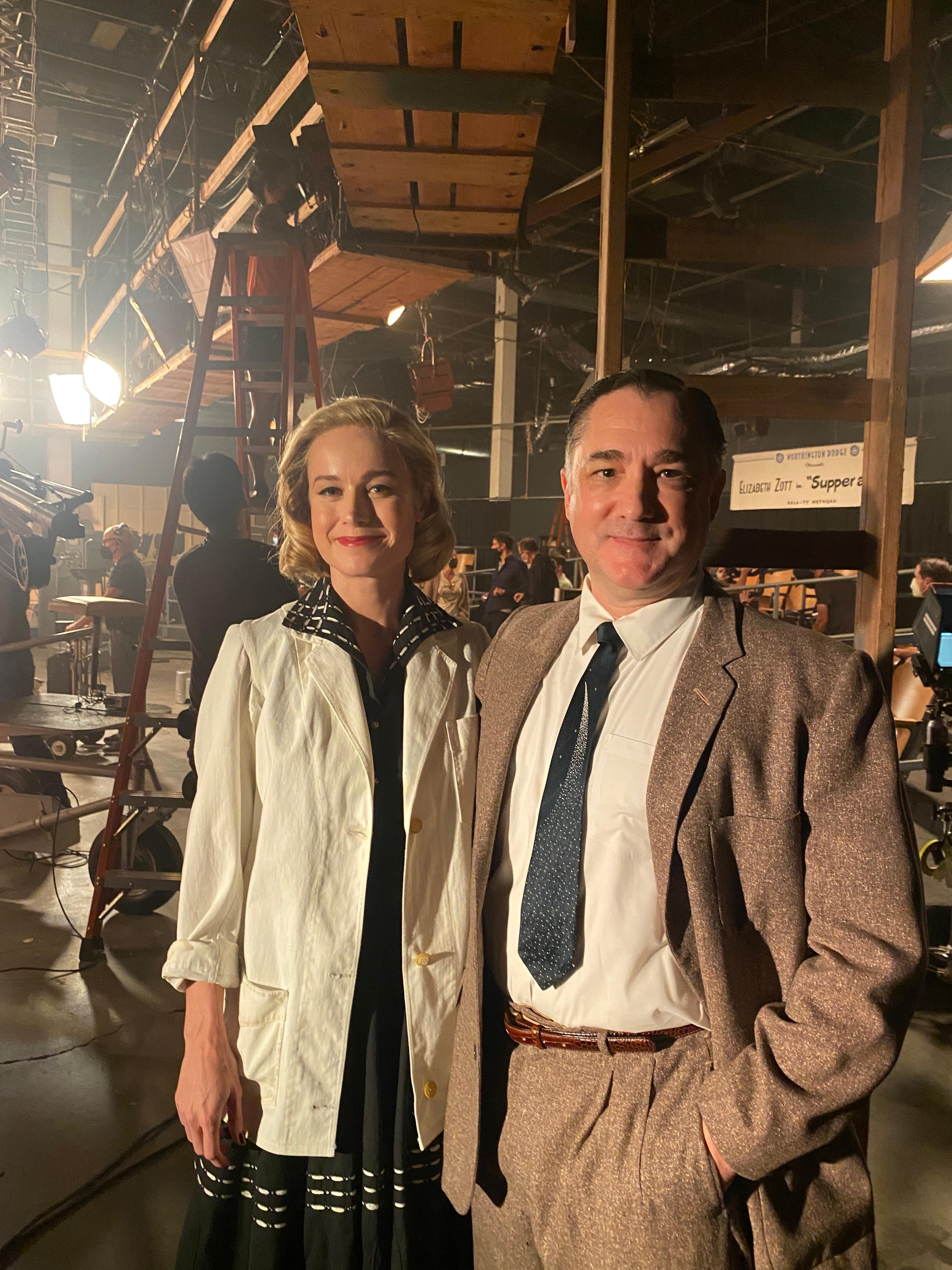 Brie Larson and John Alton on the set of "Supper at Six" (bts) in Lessons in Chemistry