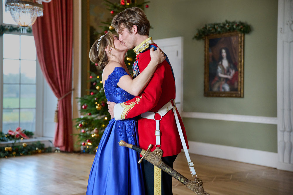 Hunter King and Jordan Renzo in A Royal Corgi Christmas (2022)