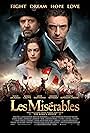 Russell Crowe, Anne Hathaway, Sacha Baron Cohen, Hugh Jackman, Amanda Seyfried, and Eddie Redmayne in Les Misérables (2012)