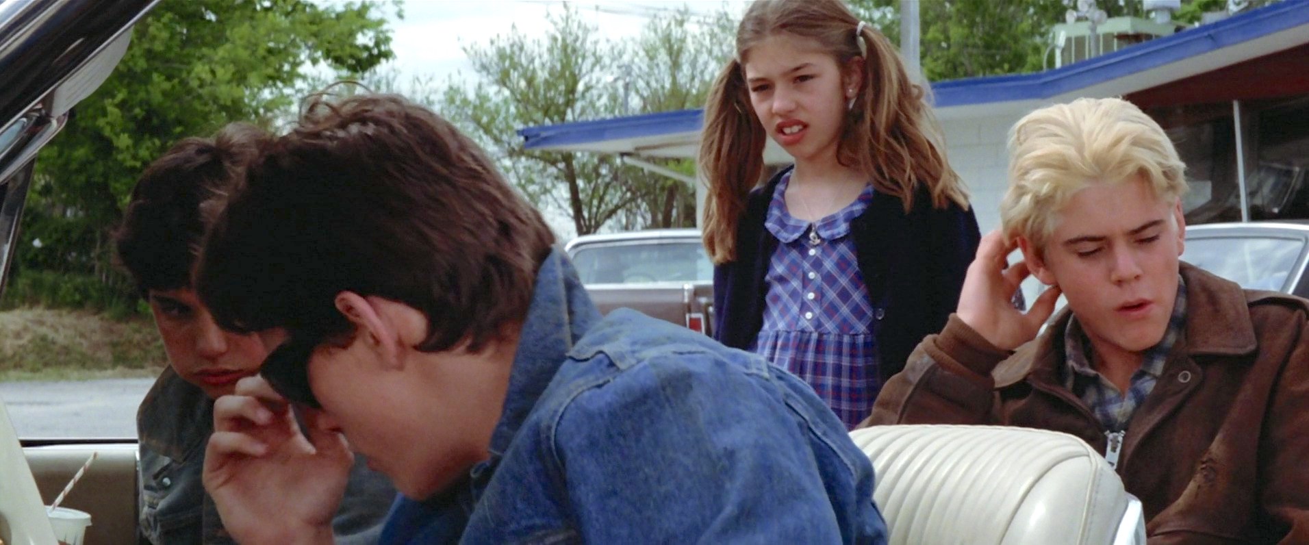 Matt Dillon, Sofia Coppola, C. Thomas Howell, and Ralph Macchio in The Outsiders (1983)