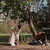 Lili Taylor, Ron Livingston, Kyla Deaver, and Dusty in The Conjuring (2013)