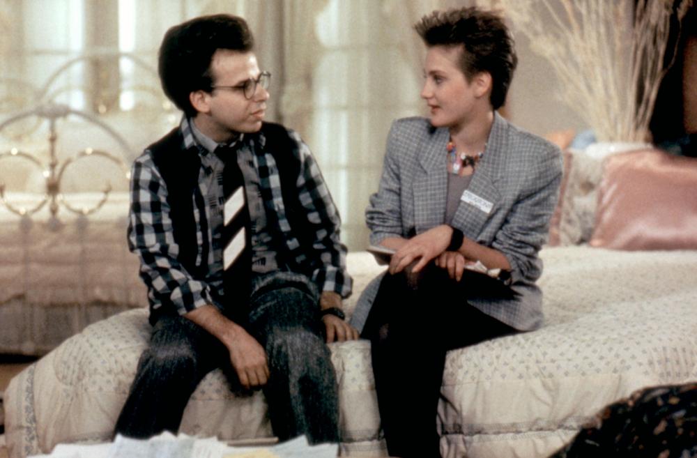 Rick Moranis and Jenny Wright in The Wild Life (1984)