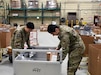 A Republic of Korea Soldier and U.S. Soldier work in the shipping area of the U.S. Army Medical Materiel Center-Korea, March 8. The two Soldiers took part in training activities as part of Freedom Shield 2024, an annual joint exercise held March 4-14, to enhance alliances and ensure defense fortification abilities on the Korean Peninsula. (Courtesy)