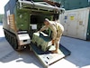 A medic with the 4th Battalion, 70th Armor Regiment, 1st Brigade Combat Team, 1st Armored Division, out of Fort Bliss, Texas, loads a medical set case onto an armored personnel carrier at the Army Prepositioned Stocks site in Korea, known as APS-4K, during Operation Pacific Fortitude. (Photo Credit: Courtesy Shawn Hardiek)