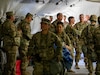 U.S. Army Reserve Soldiers secure a simulated casualty onto a stretcher to transport to the 352nd Field Hospital Operating Room during the multi-national medical training exercise, Global Medic, at Fort Hunter Liggett, California, on June 7, 2024. The Medical Readiness Training Command executes Exercise Global Medic as part of the 807th Medical Command (Deployment Support) and Army Reserve Medical Command's larger mission to deliver relevant and realistic collective training to medical units and Soldiers preparing for large scale combat operations. (U.S. Army photo by Spc. Midori Preecs)