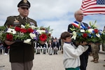 Maj. Gen. Joseph A. Dinonno, commander of the 29th Infantry Division, lays a wreath along with a French dignitary at the National Guard Monument situated above Omaha Beach in Vierville-sur-Mer, France, June 2, 2024. This monument sits at the spot where National Guard Soldiers of the 29th Infantry Division broke through German defenses on D-Day, June 6, 1944. Commemorative events such as these serve to honor the sacrifices U.S. service members made 80 years ago in securing peace and security, and inspiring future generations to value a collective vision of global peace.