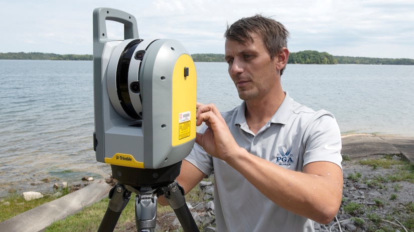 Surveyor Trevor Groce, U.S. Army Corps of Engineers Nashville District, operates a terrestrial scanner Sept. 3, 2024, to assess the condition of an existing boat ramp at J. Percy Priest Lake in Nashville, Tennessee. Groce is the district’s employee of the month for May 2024. (USACE Photo by Lee Roberts)