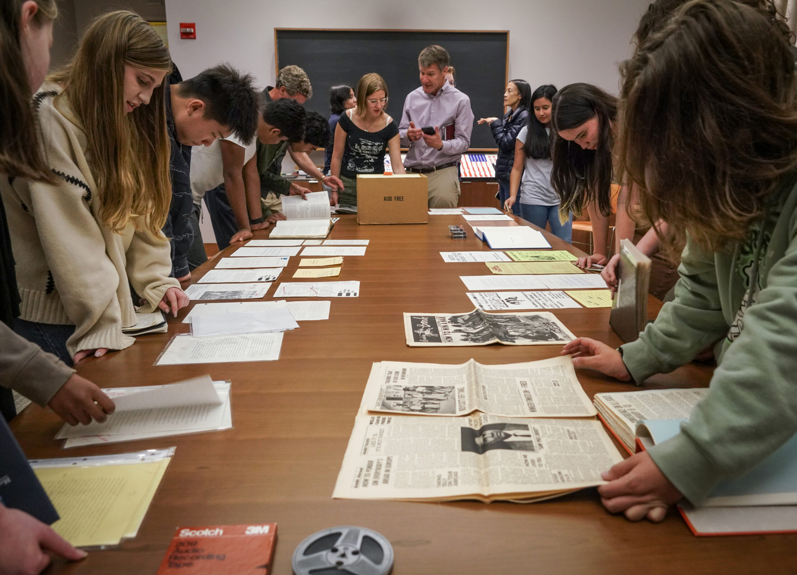 High schoolers from Hillbrook School in San Jose talk about items on display in The Bancroft Library on Aug. 30, 2024.