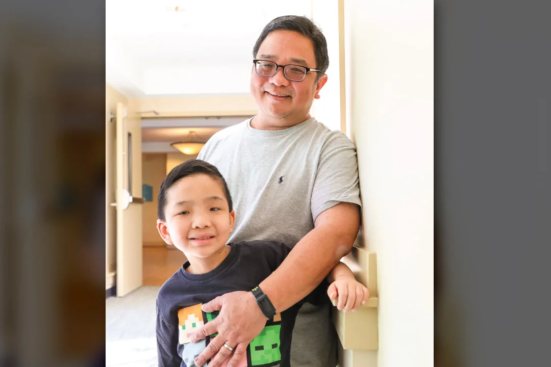 Nelson and his father guy smiling together