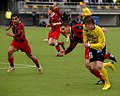 KuPS v. PK-35, Finnish Veikkausliiga, players sprinting.