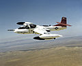 An OA-37 Dragonfly aircraft with a Mark 20 bomb mounted under the right wing and a Mark 82 500-lb. general-purpose bomb under the left. Location: EDWARDS AIR FORCE BASE, CALIFORNIA (CA)