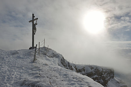 Woodcarved summit crucifix on the mount Seceda in Gröden