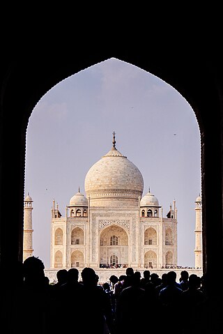 Taj Mahal and crowd of people to see magnificent Taj Mahal.