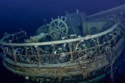 The taffrail and wheel of the Endurance underwater, as seen over a century after it sank. (Credit: Falklands Maritime Heritage Trust)