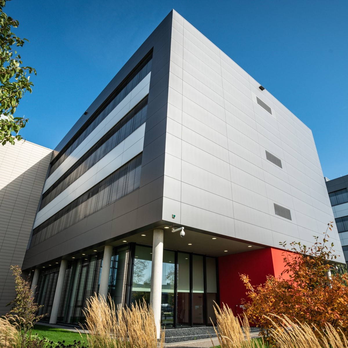 office building (photo from outside, showing a dramatic perspective on the leading edge corner)