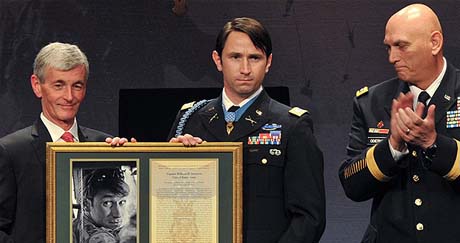 Secretary of the Army John McHugh presents former Capt. William D. Swenson his framed Medal of Honor citation at a ceremony inducting Swenson into the Pentagons Hall of Heroes, Oct. 16, 2013, as Army Chief of Staff Gen. Ray Odierno looks on. (Photo Credit: U.S. Army)