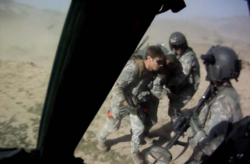 Image captured from video depicting the battlefield actions of Cpt. Swenson on Sept. 8, 2009 near the village of Ganjgal in Kunar Province, Afghanistan. He directed MedEvac landing for the evacuation of his critically injured teammate, Sgt. 1st Class Kenneth Westbrook.  The video was captured by two different MedEvac crew members and shows each crew member's perspective of events spanning the same time period. Video is courtesy of Mrs. Charlene Westbrook.