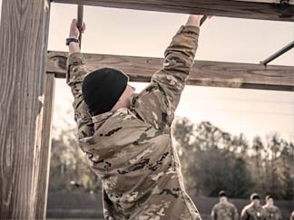 (FORT BENNING, Ga) - Officer Candidate School students from Charlie Co, Class 003-22, complete the Bolton Confidence Course January 12, 2022. The course helps build confidence and trust in each student and their fellow team members. Capt. William D. Swenson joined the U.S. Army in 2002. He then attended Officer Candidate School at Fort Benning, Ga., where he was commissioned as a second lieutenant. (U.S. Army photo by Patrick A. Albright, Fort Benning Maneuver Center of Excellence).