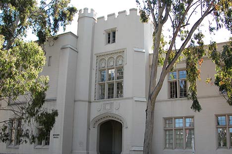 Medieval looking building facade with arched doorway