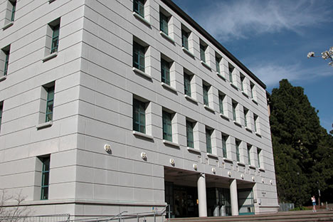 White four story building with blue sky