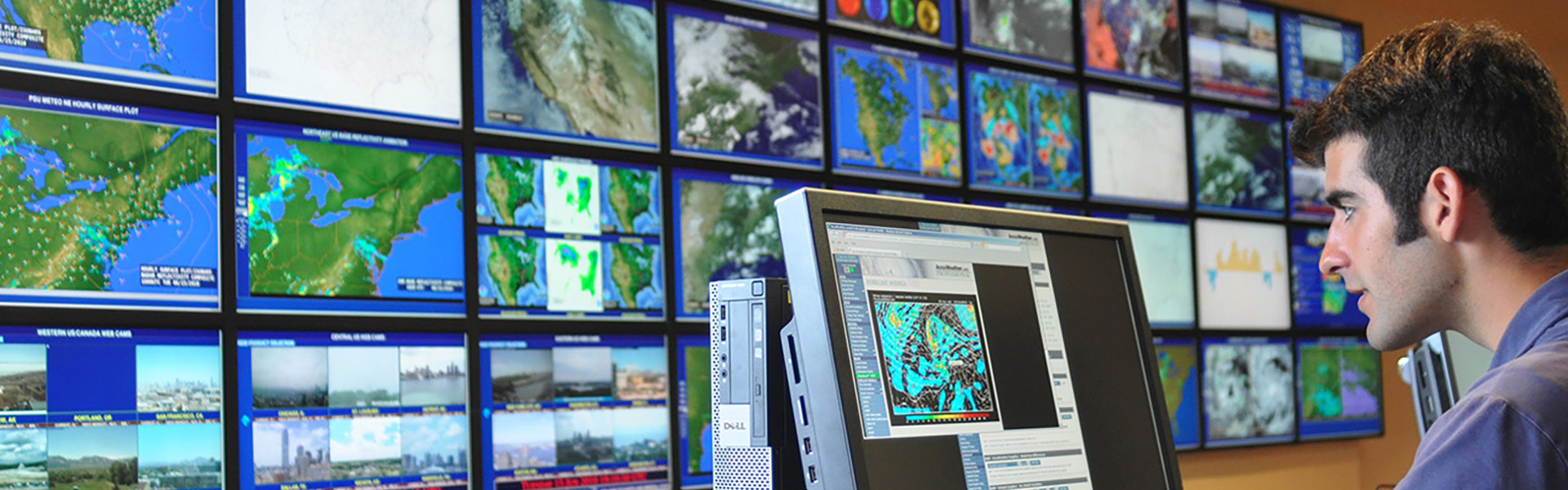 Student at Computer Map Wall