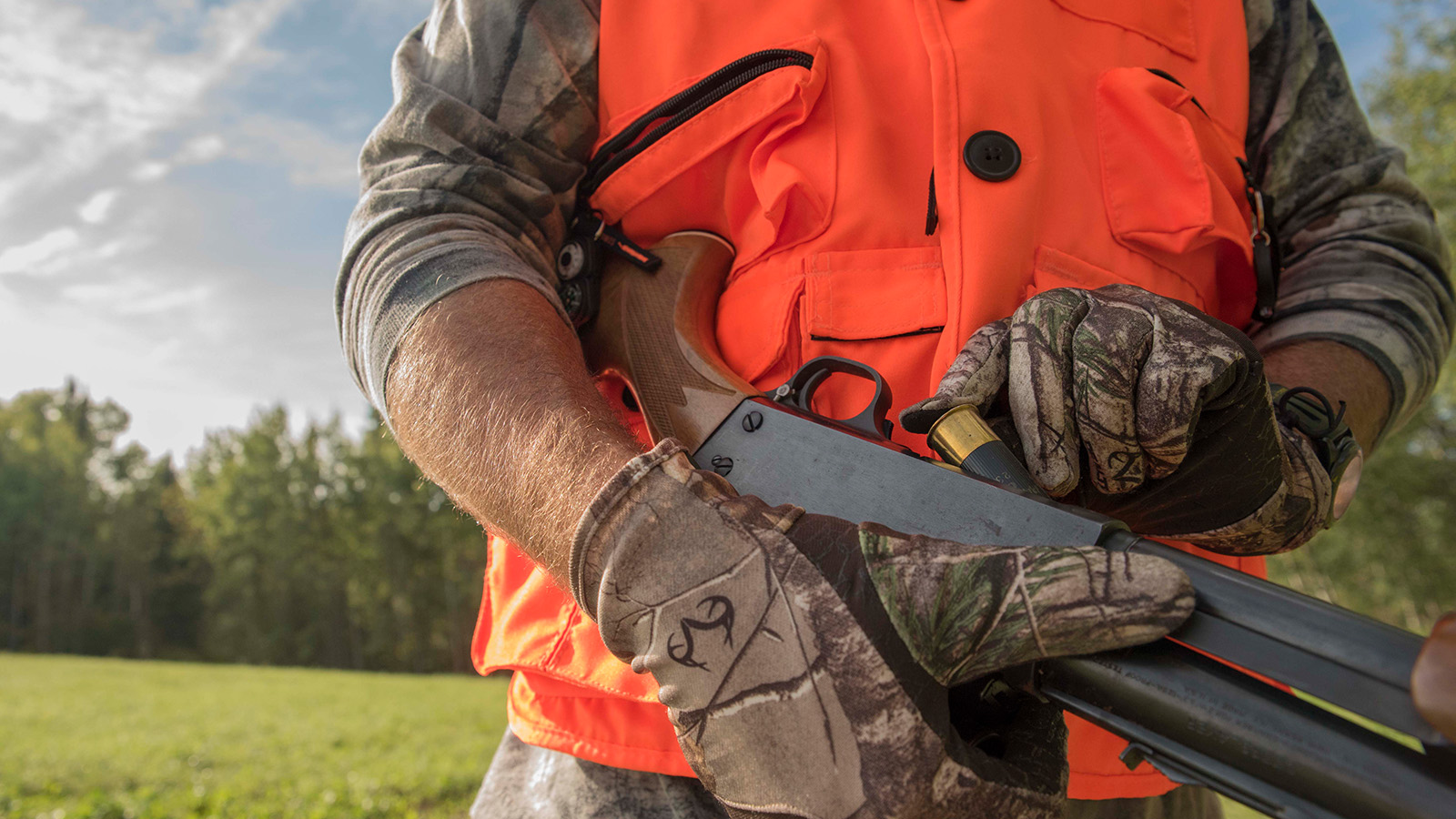 Hunter loading a shotgun