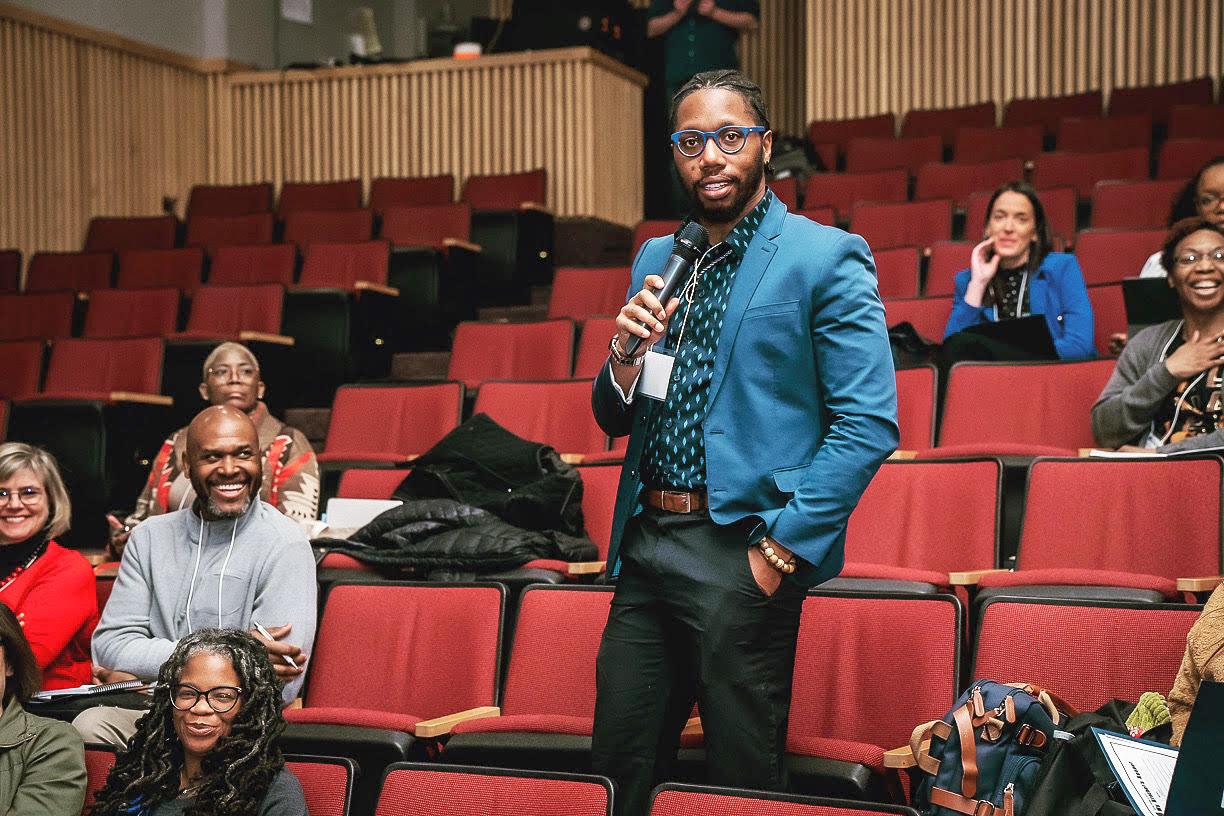 Issac McGee speaking at a conference