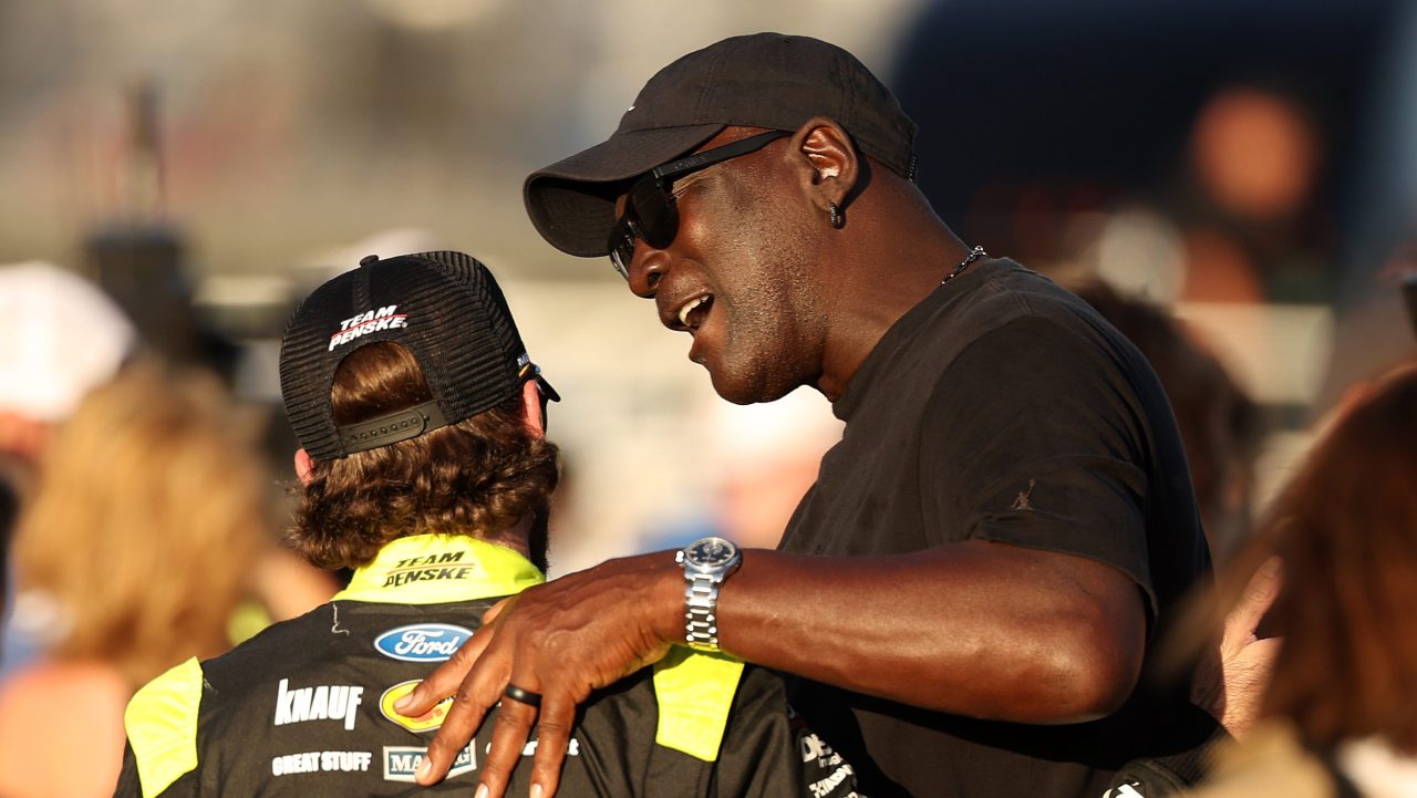 Michael Jordan, co-owner of 23XI Racing, speaks to Ryan Blaney