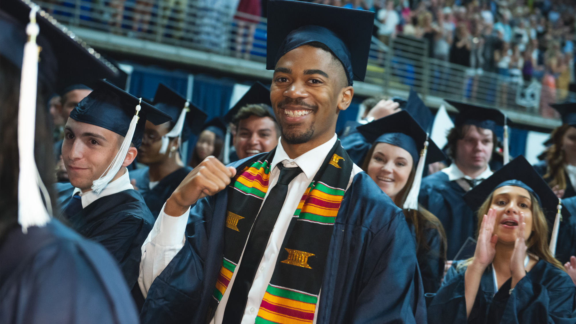 Penn State students wearing caps and gowns at their commencement ceremony